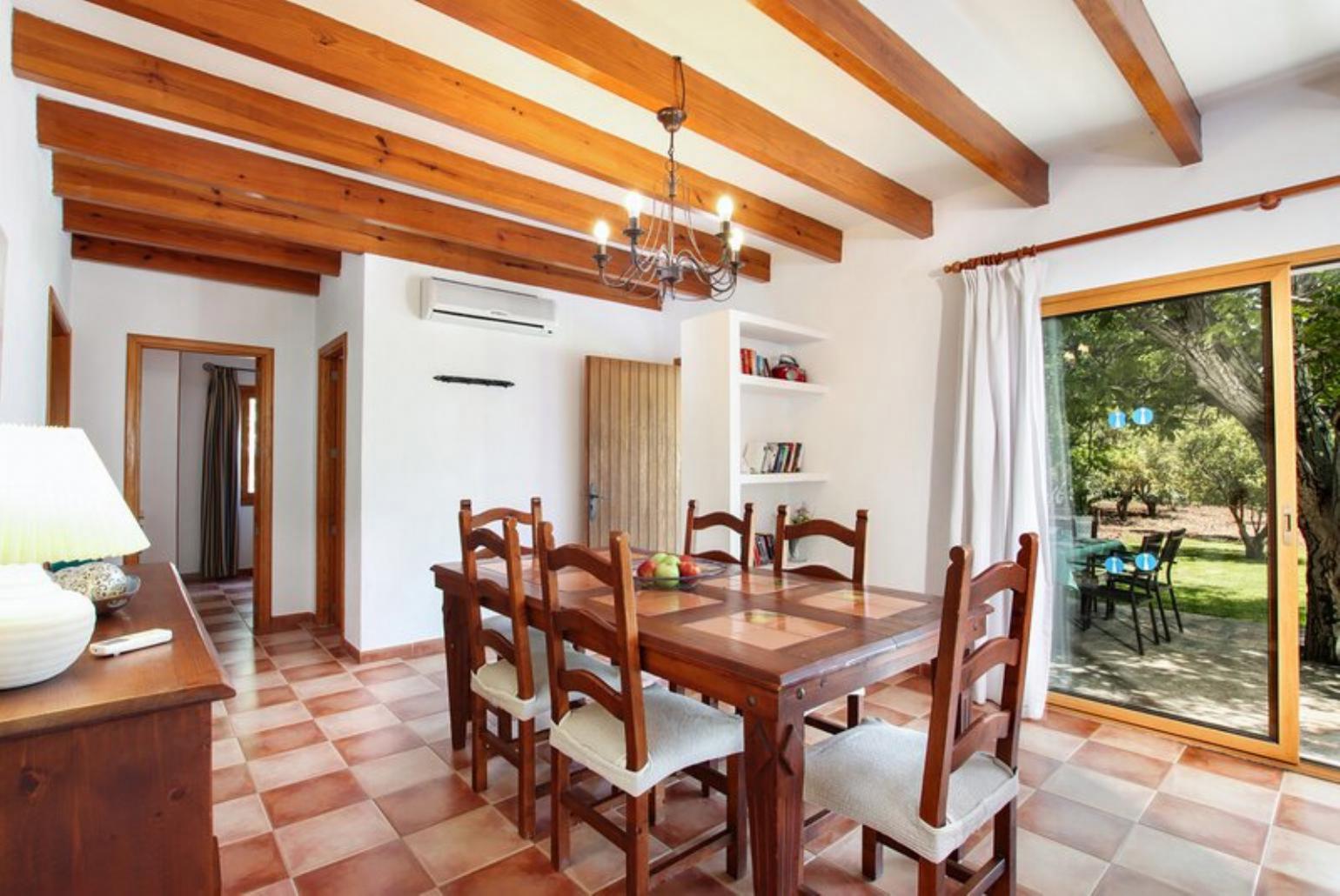 Living room with sofas, dining area, ornamental fireplace, A/C, WiFi internet, and satellite TV