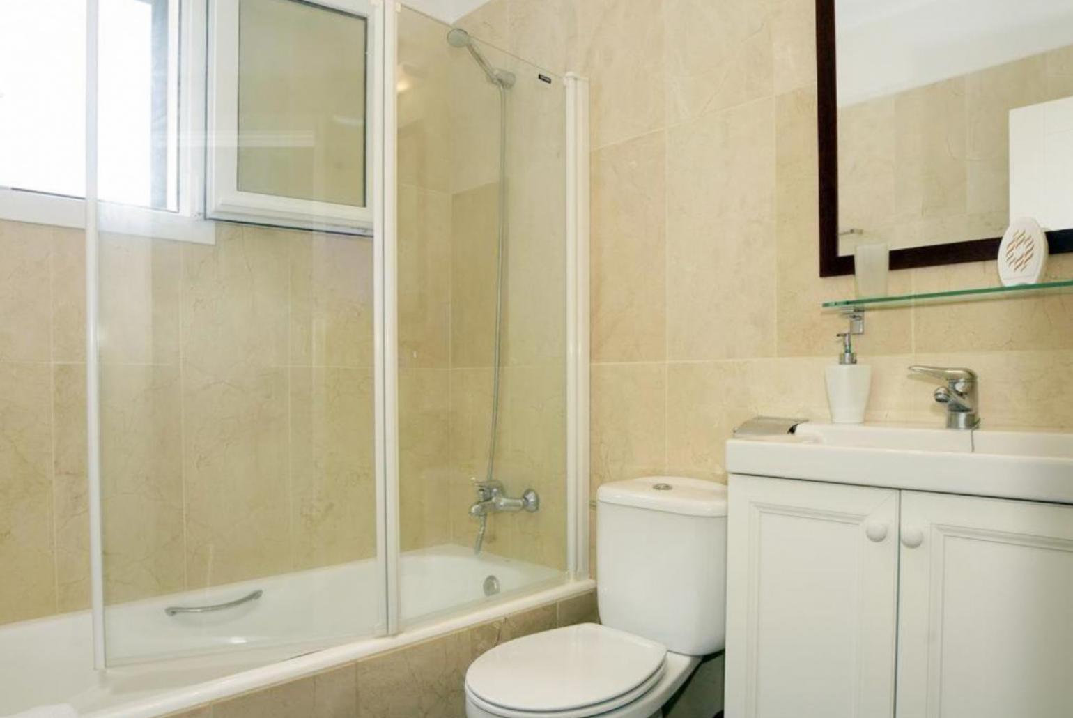 Family bathroom with bath and shower