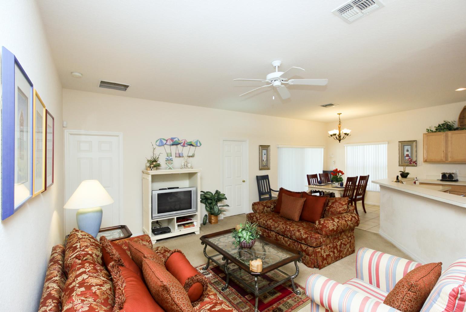 Open-plan living room with dining area and kitchen.