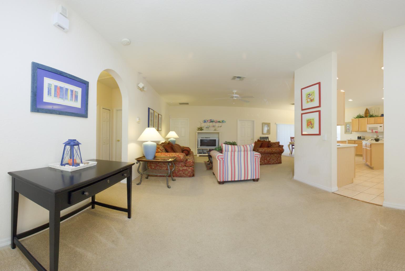 Open-plan living room with dining area and kitchen.