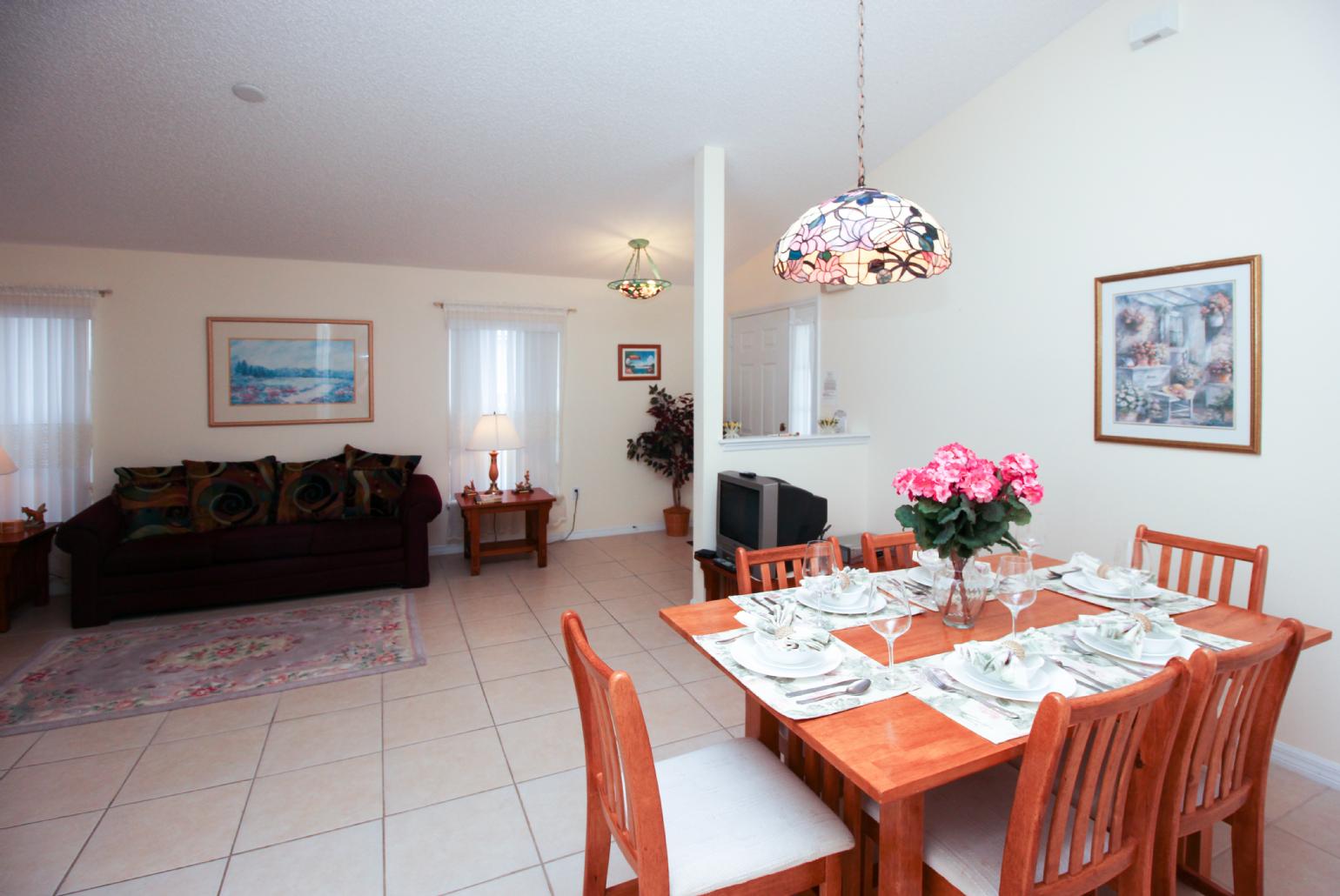 Open-plan living room with dining area and kitchen.