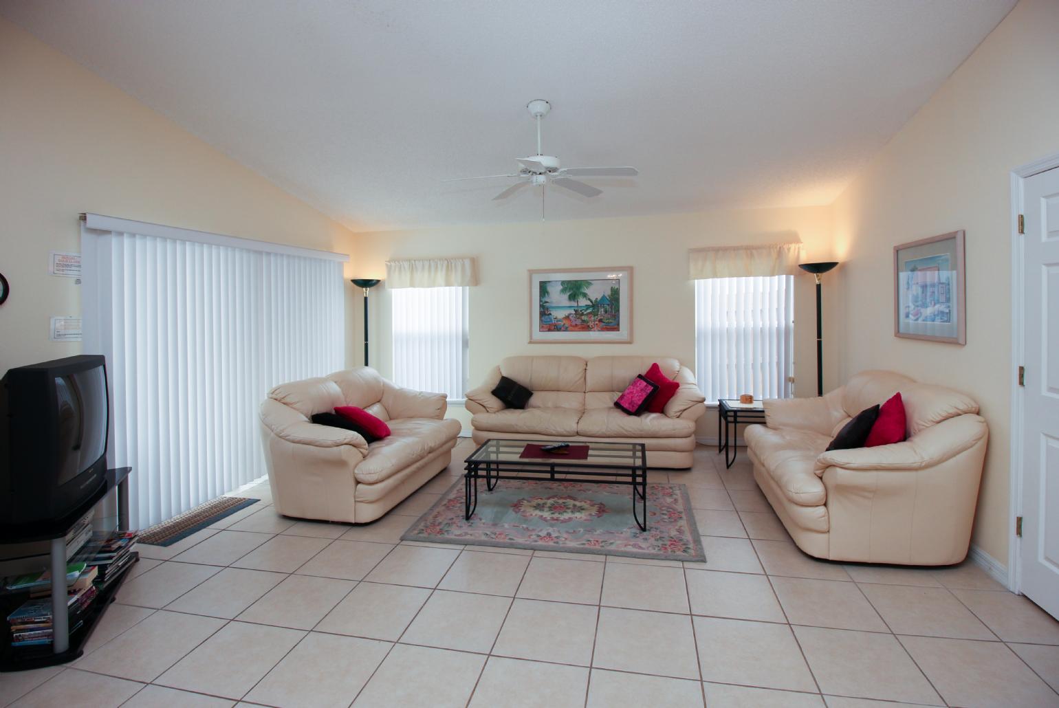 Open-plan living room with dining area and kitchen.