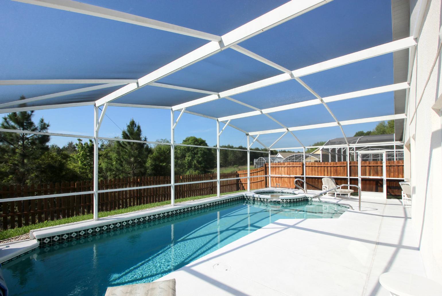 Private pool area with sunbeds.