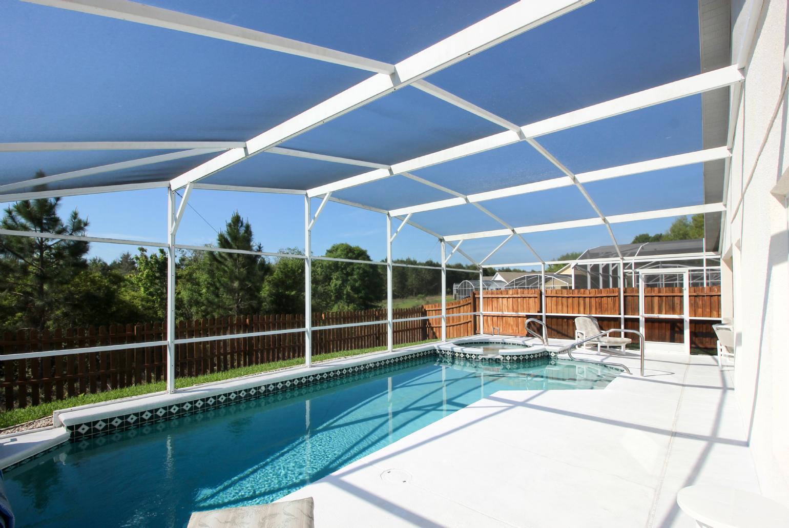 Private pool area with sunbeds.