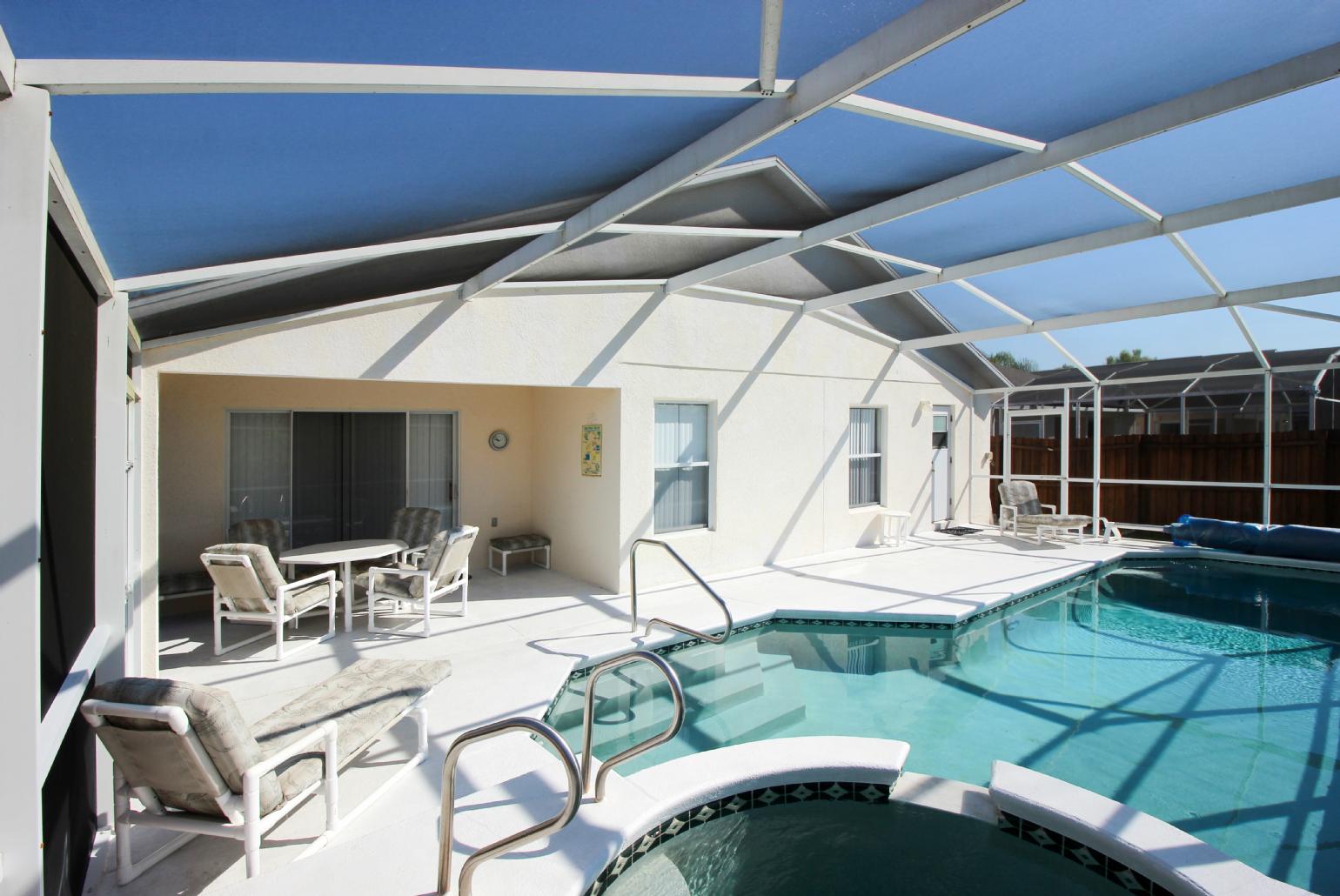 Private pool area with sunbeds.