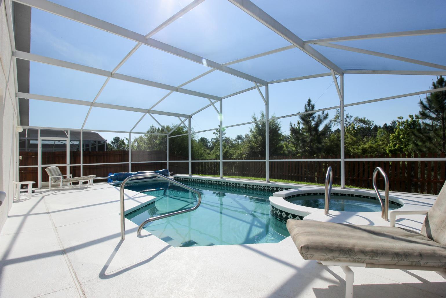 Private pool area with sunbeds.