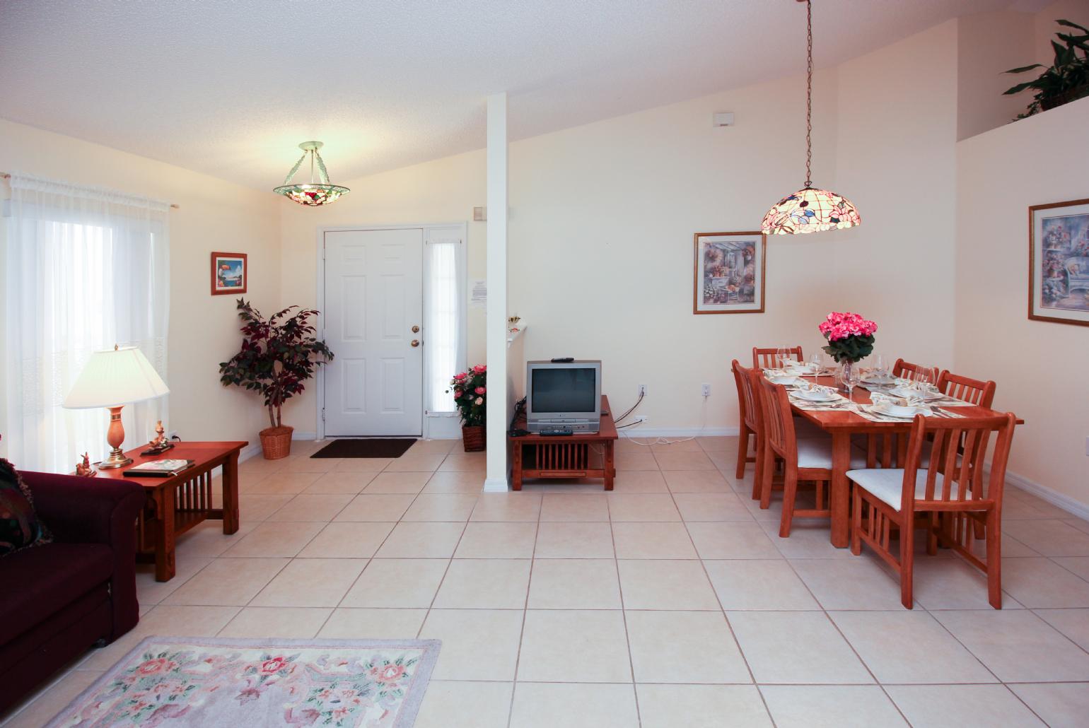 Open-plan living room with dining area and kitchen.