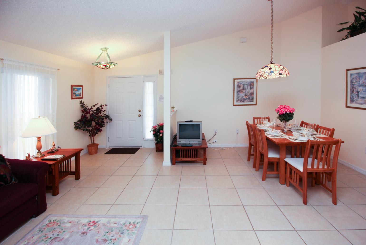 Open-plan living room with dining area and kitchen.