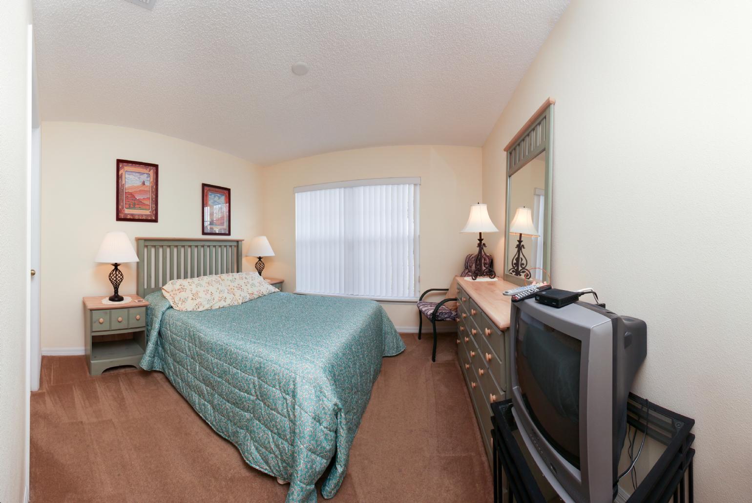 Double bedroom with TV.