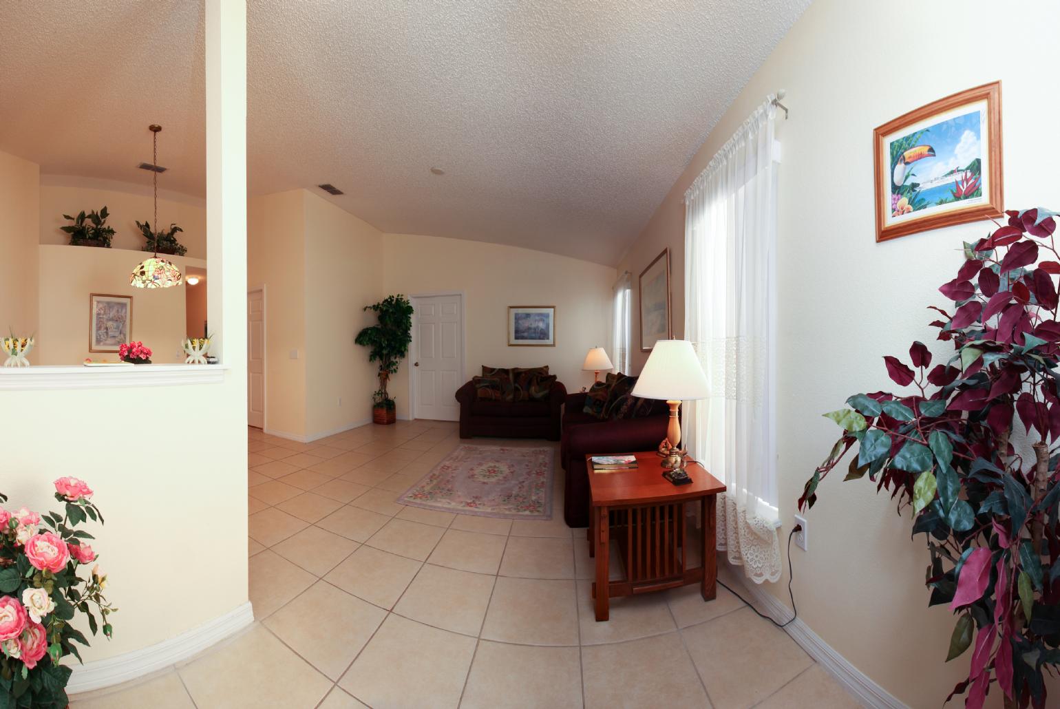 Open-plan living room with dining area and kitchen.