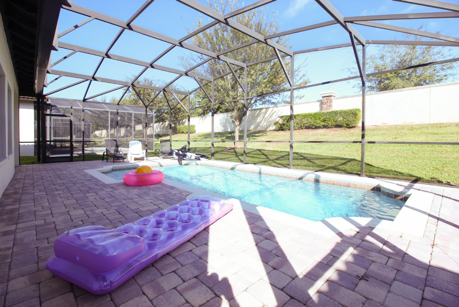 Private pool area with sunbeds.