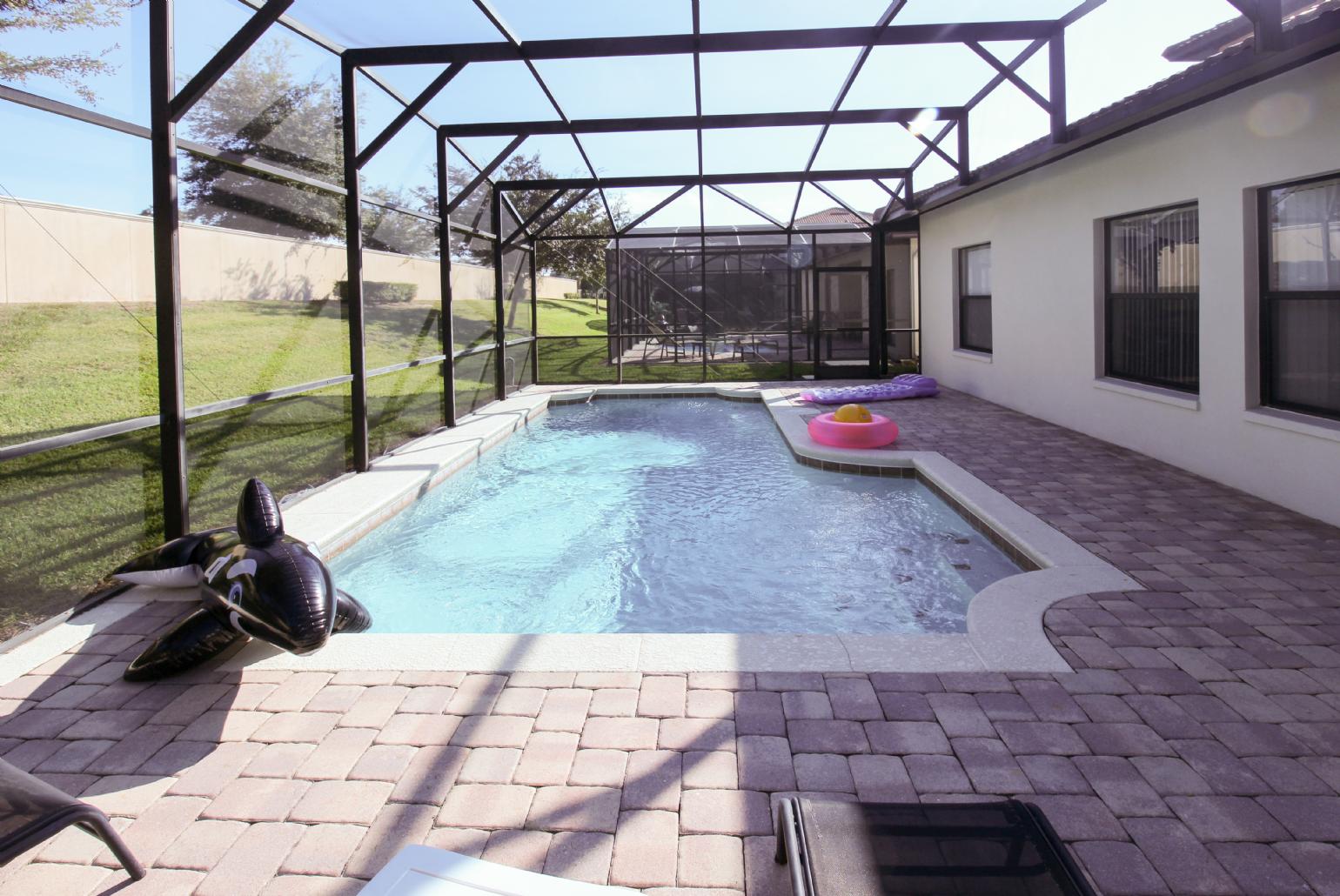 Private pool area with sunbeds.