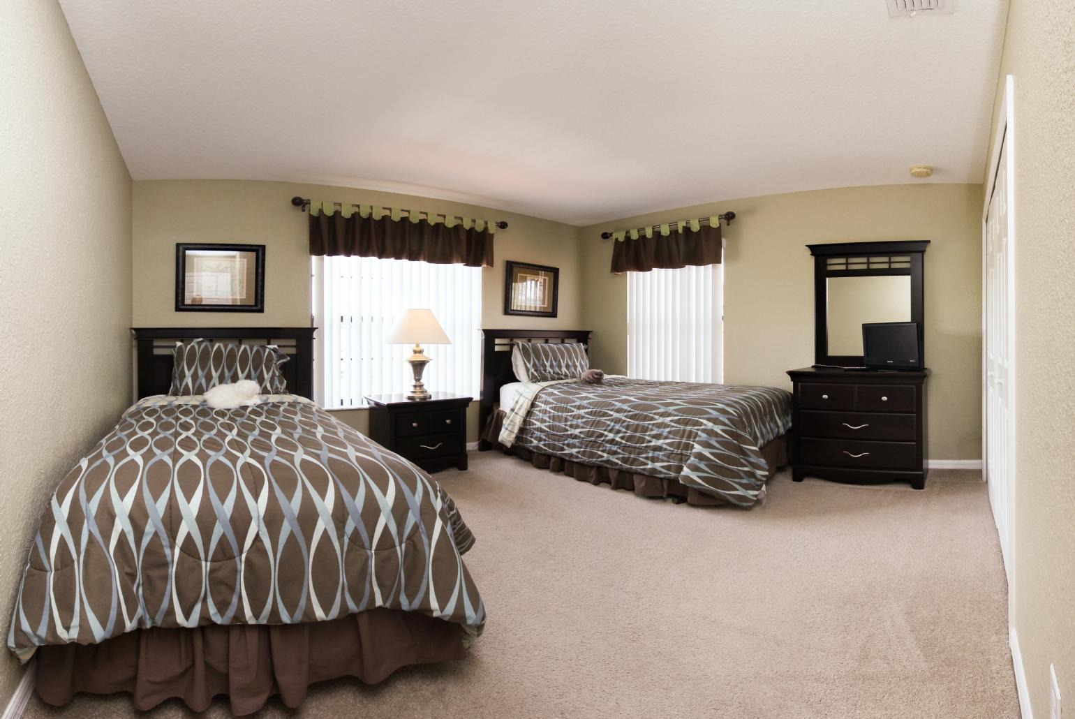 Twin bedroom with TV.