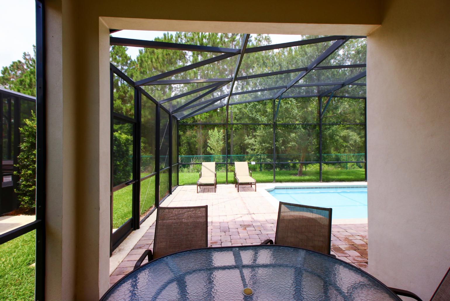 Private pool area with sunbeds.