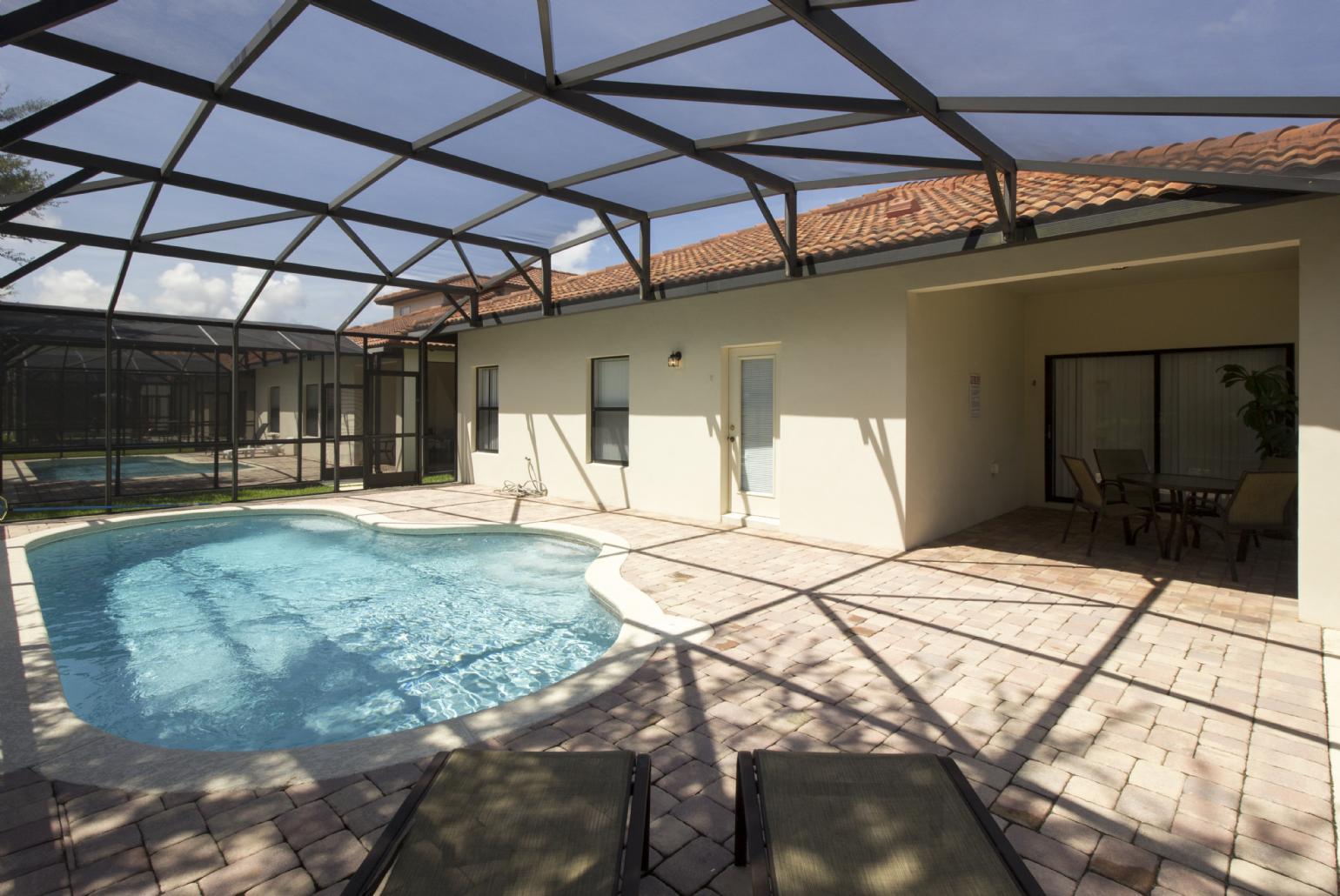 Private pool area with sunbeds.