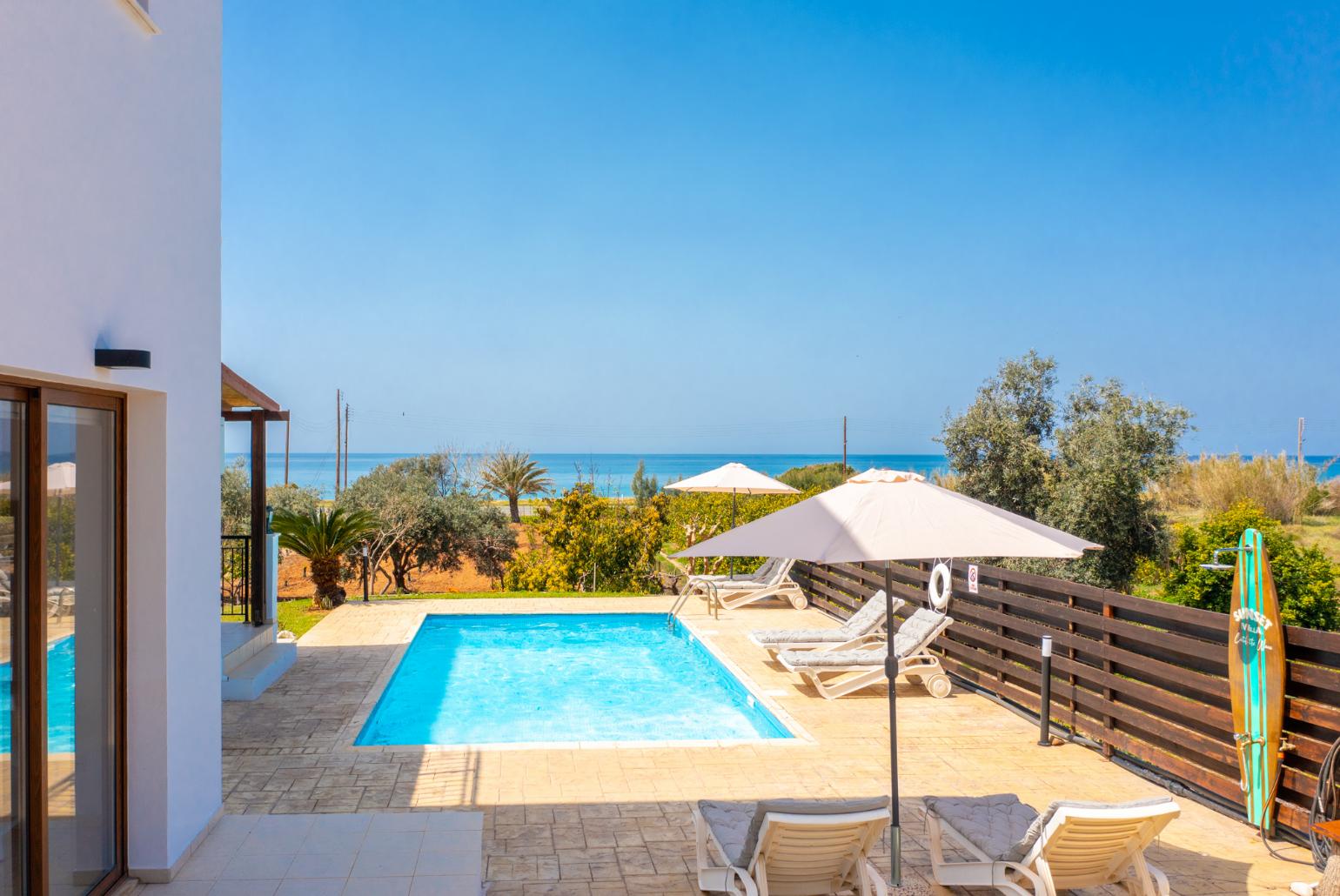 Private pool, terrace, and garden with panoramic sea views
