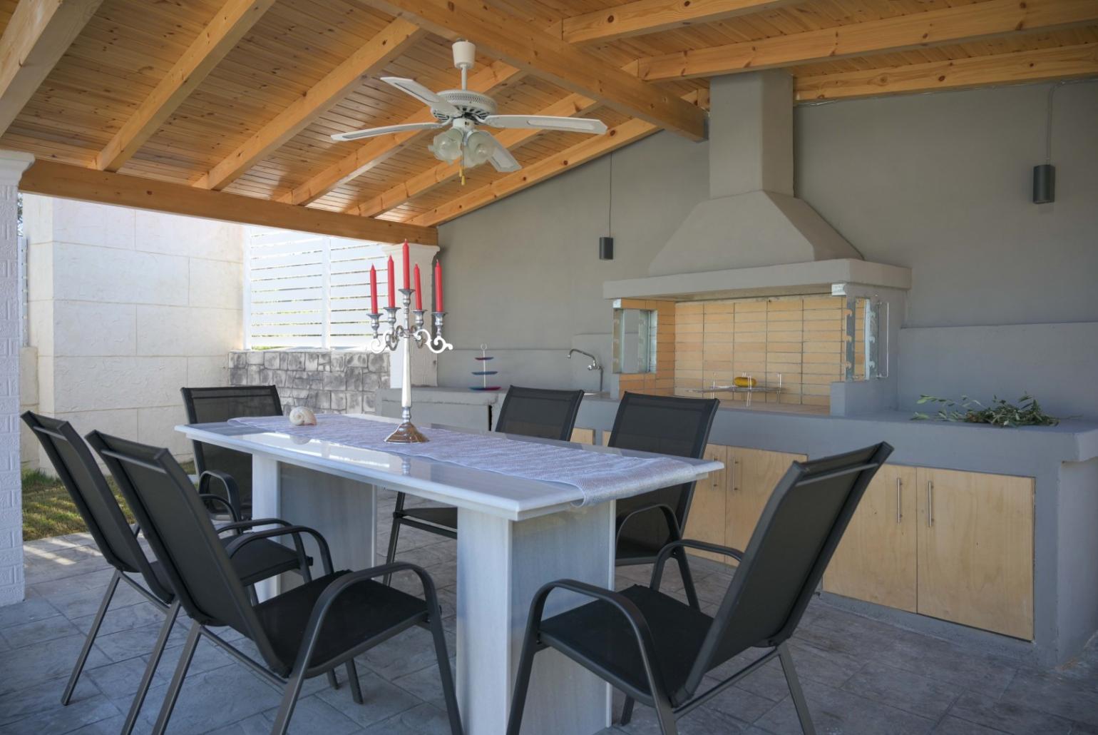 Outdoor kitchen, BBQ and dining table