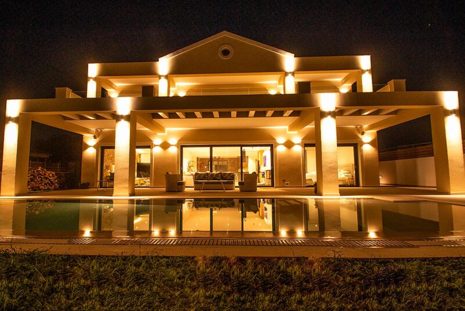Night view of beautiful private villa with private heated pool, spa and wine cellar