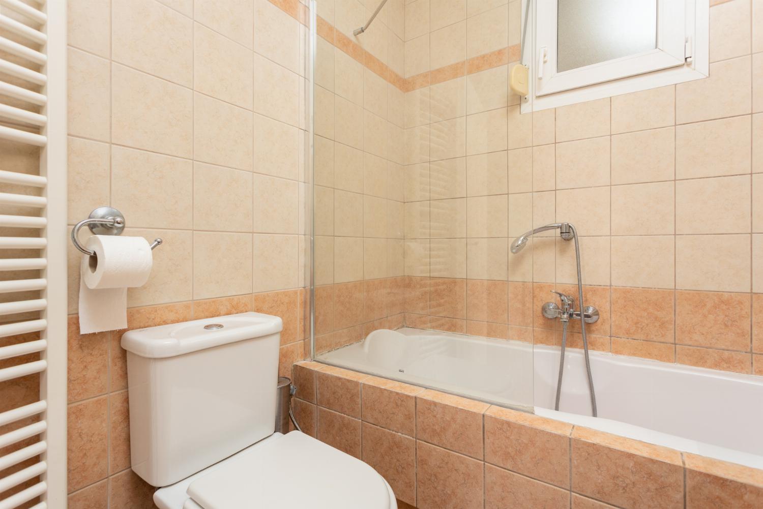 Family bathroom with bath and shower