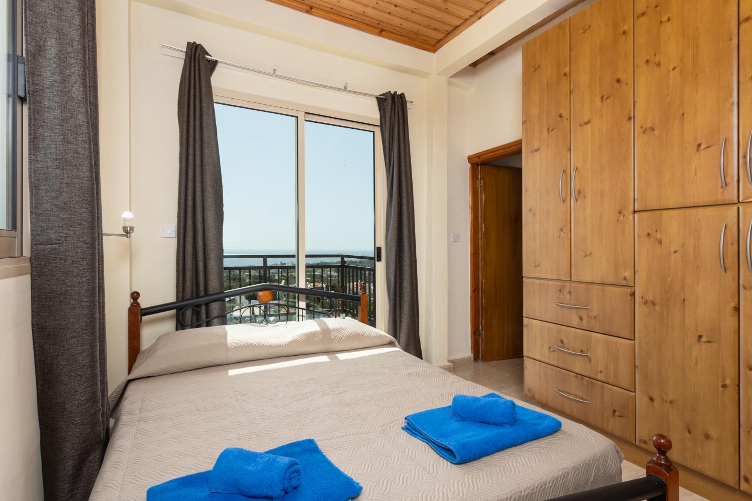 Double bedroom on first floor with en suite bathroom, A/C, sea views, and balcony access