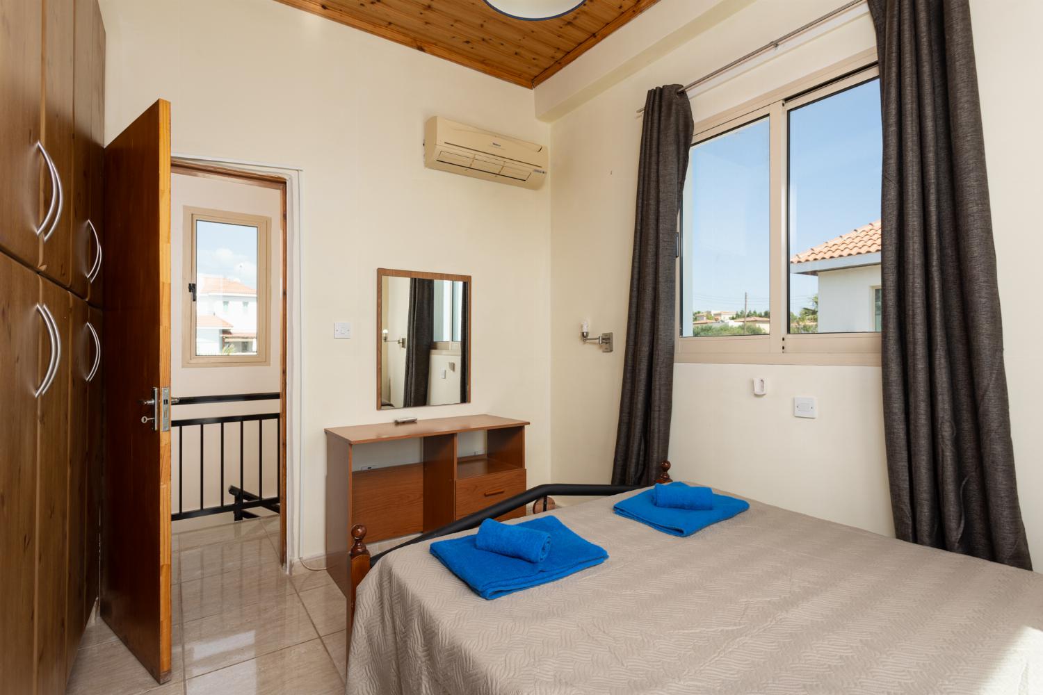 Double bedroom on first floor with en suite bathroom, A/C, sea views, and balcony access
