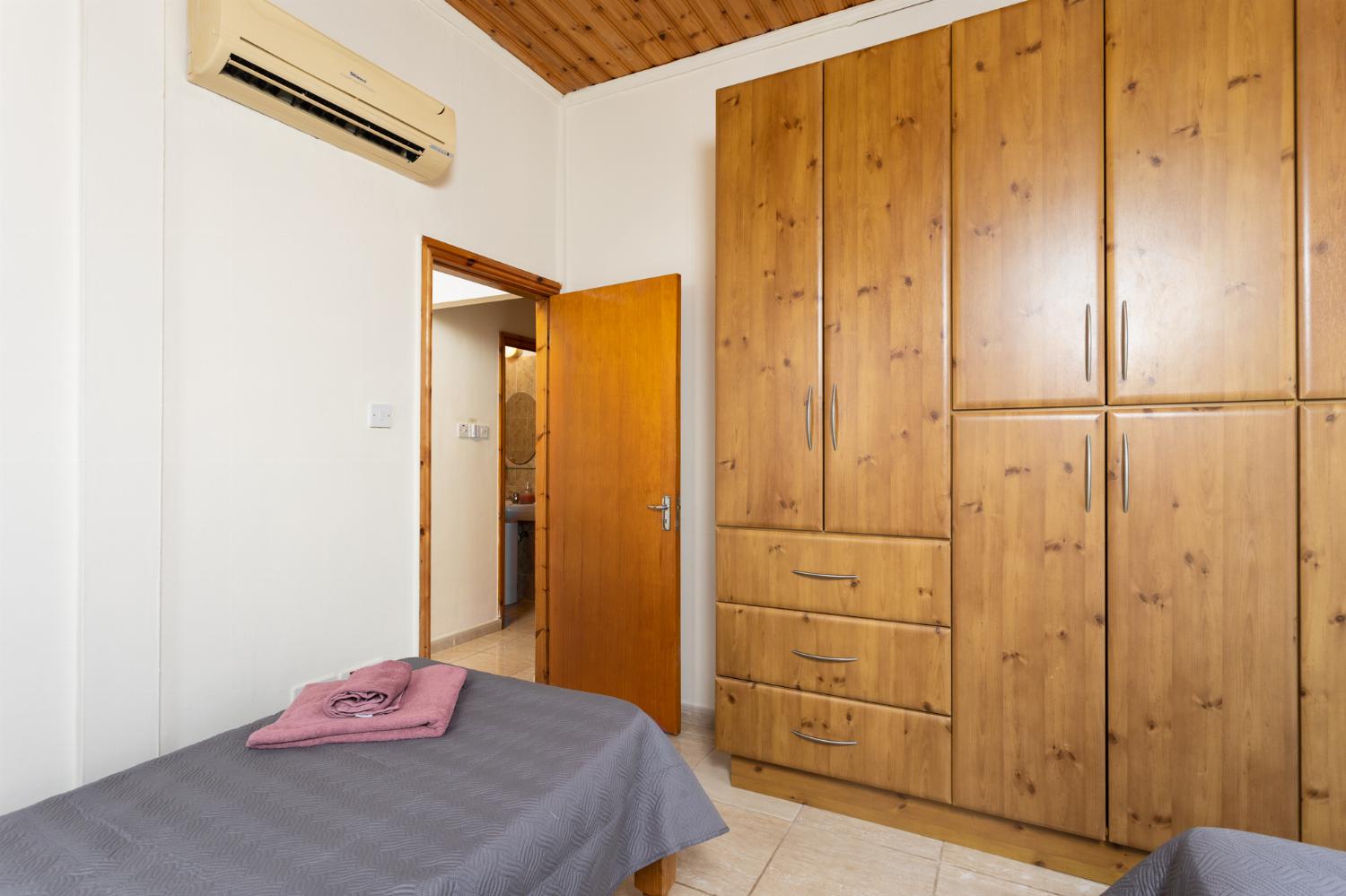 Twin bedroom with A/C and balcony access