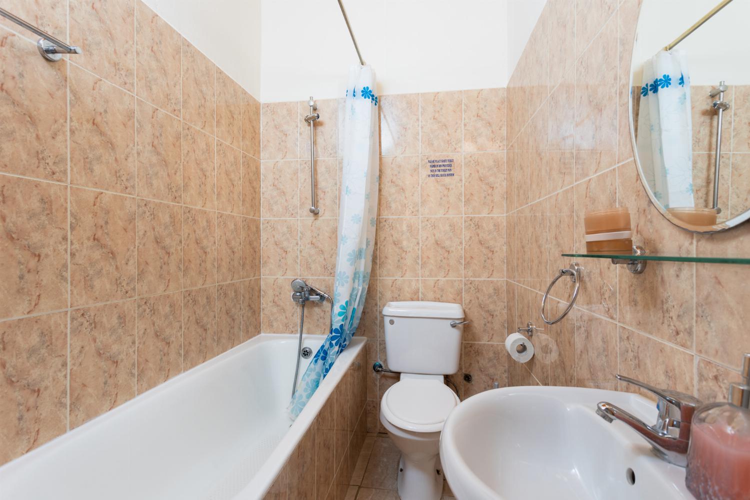 Family bathroom with bath and shower