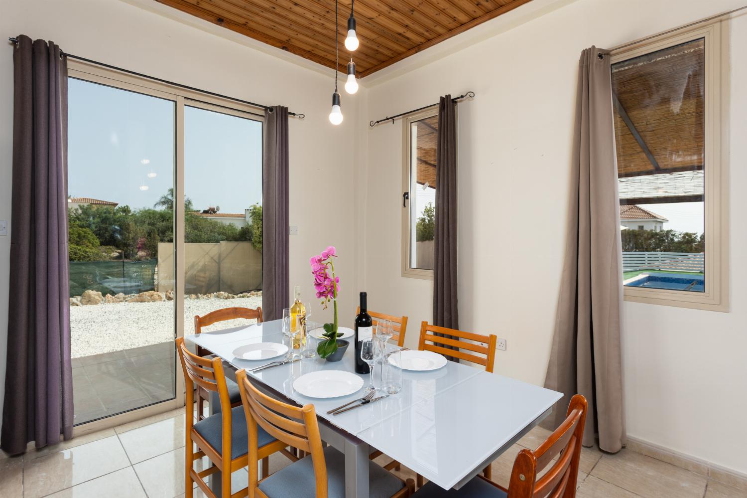 Open-plan living room with sofas, dining area, kitchen, WiFi internet, satellite TV, and sea views