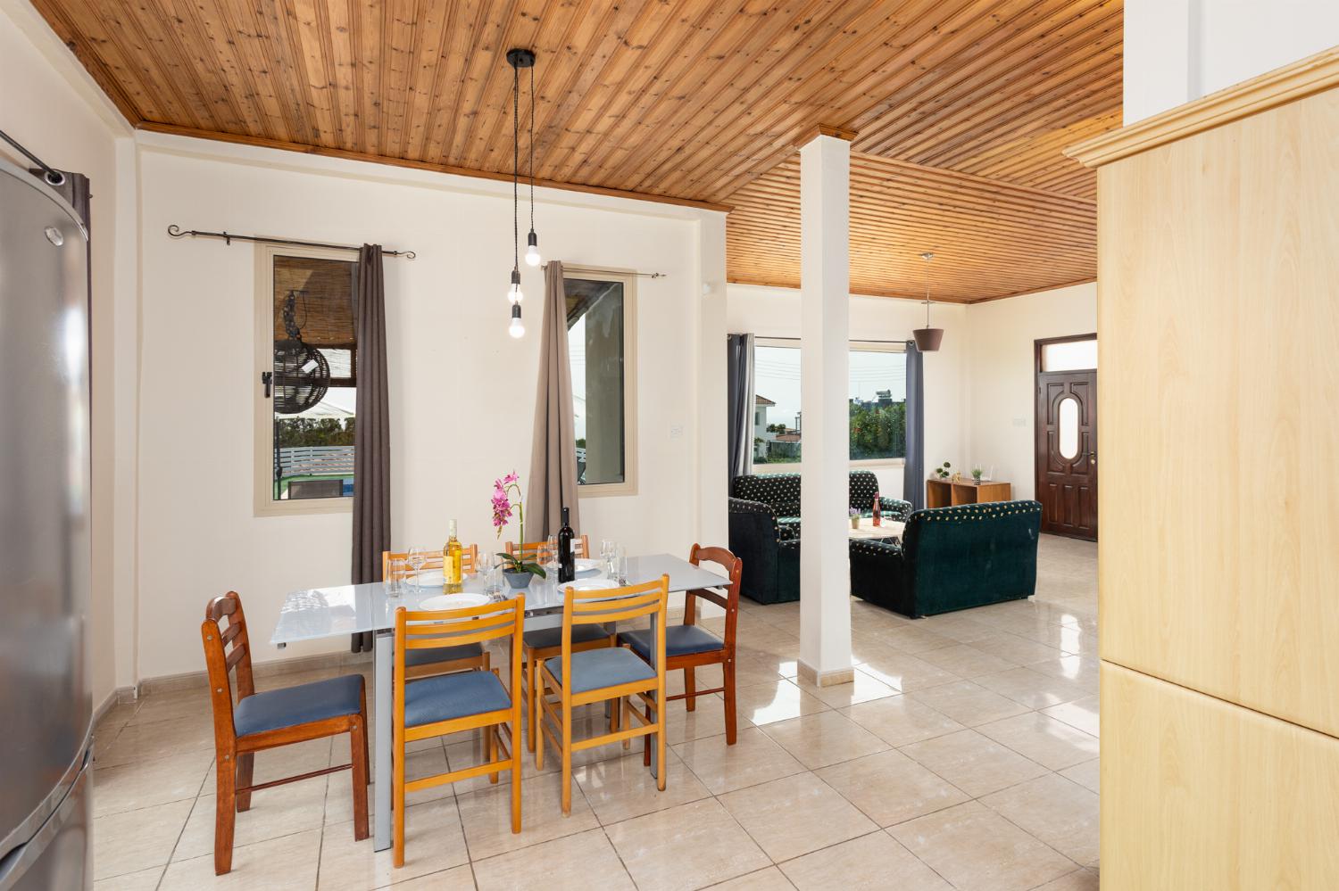 Open-plan living room with sofas, dining area, kitchen, WiFi internet, satellite TV, and sea views
