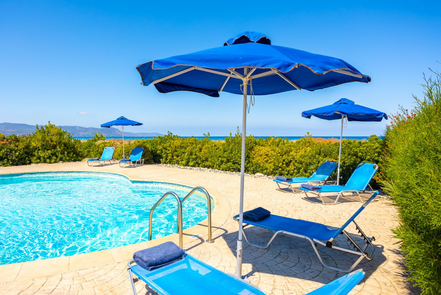 Private pool, terrace, and garden with sea views