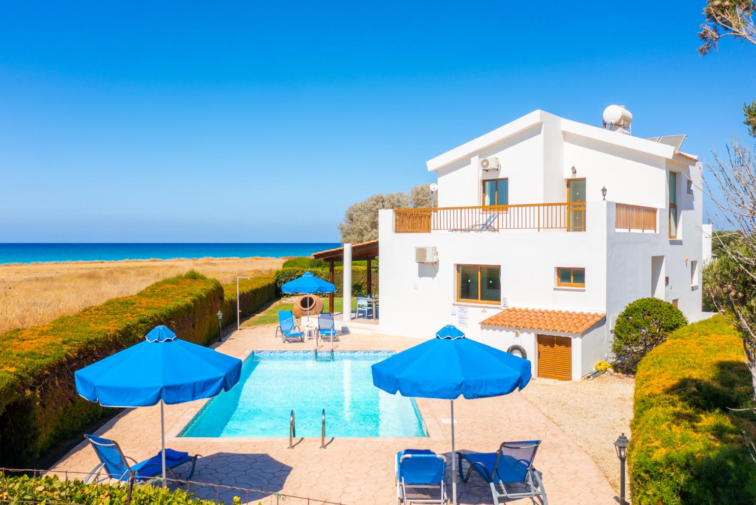 ,Beautiful villa with private pool, terrace, and garden with sea views