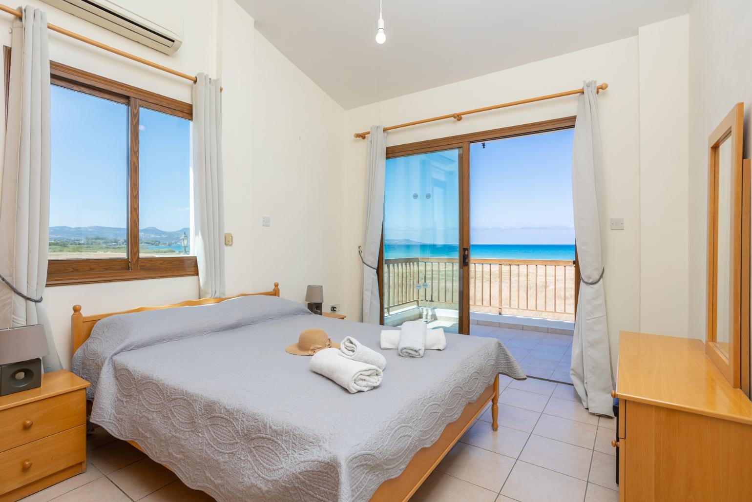 Double bedroom with A/C, sea views, and balcony access