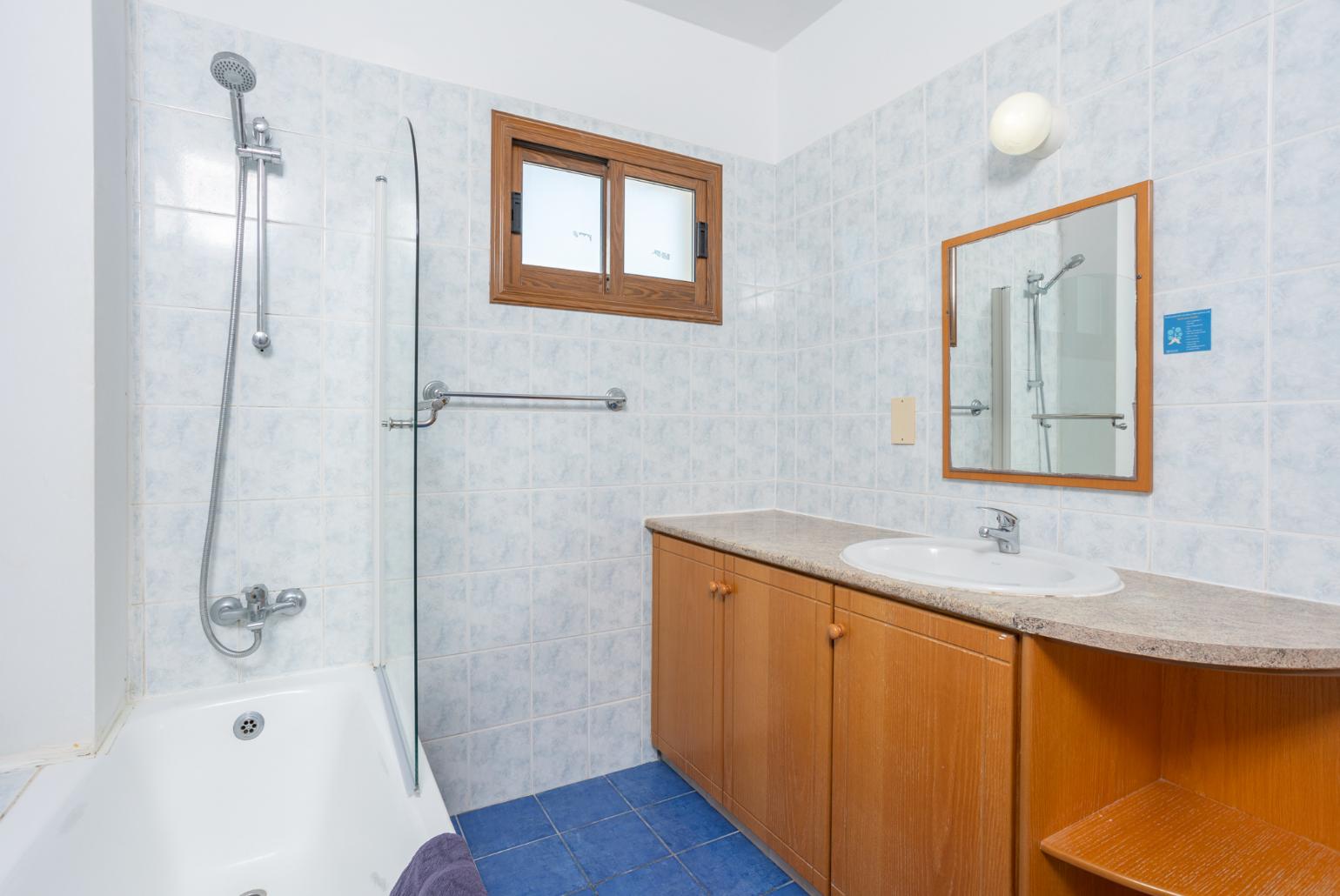 Family bathroom with bath and shower