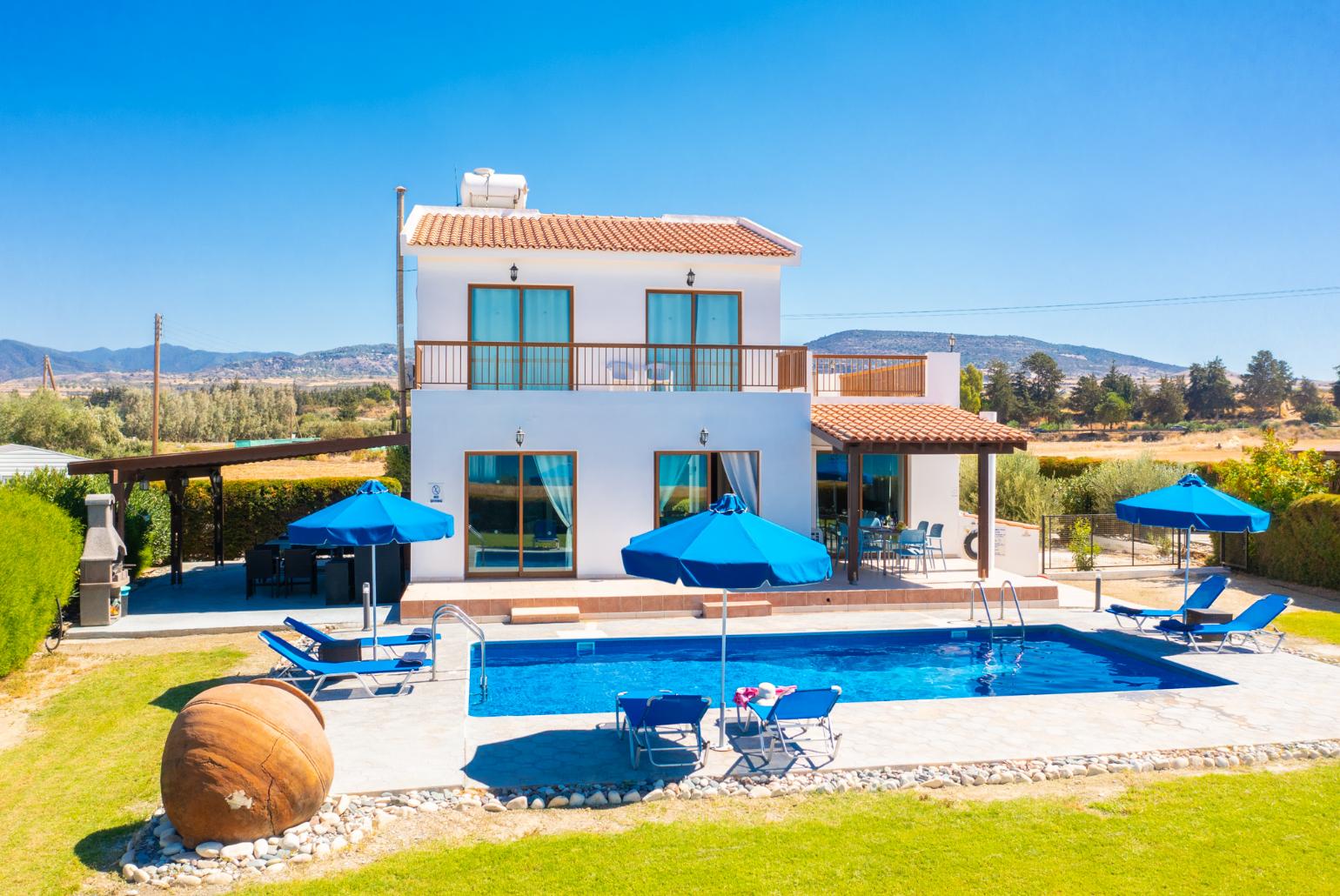 ,Beautiful villa with private pool, terrace, and garden with sea views