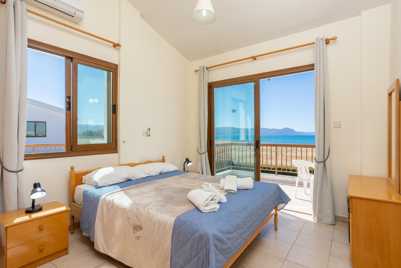 Double bedroom with A/C, sea views, and balcony access