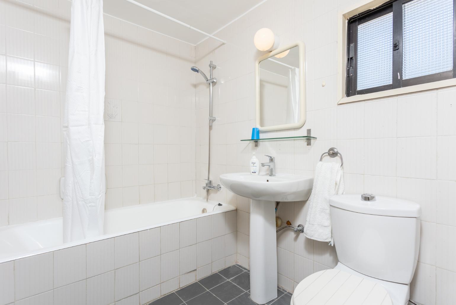 Family bathroom with bath and shower