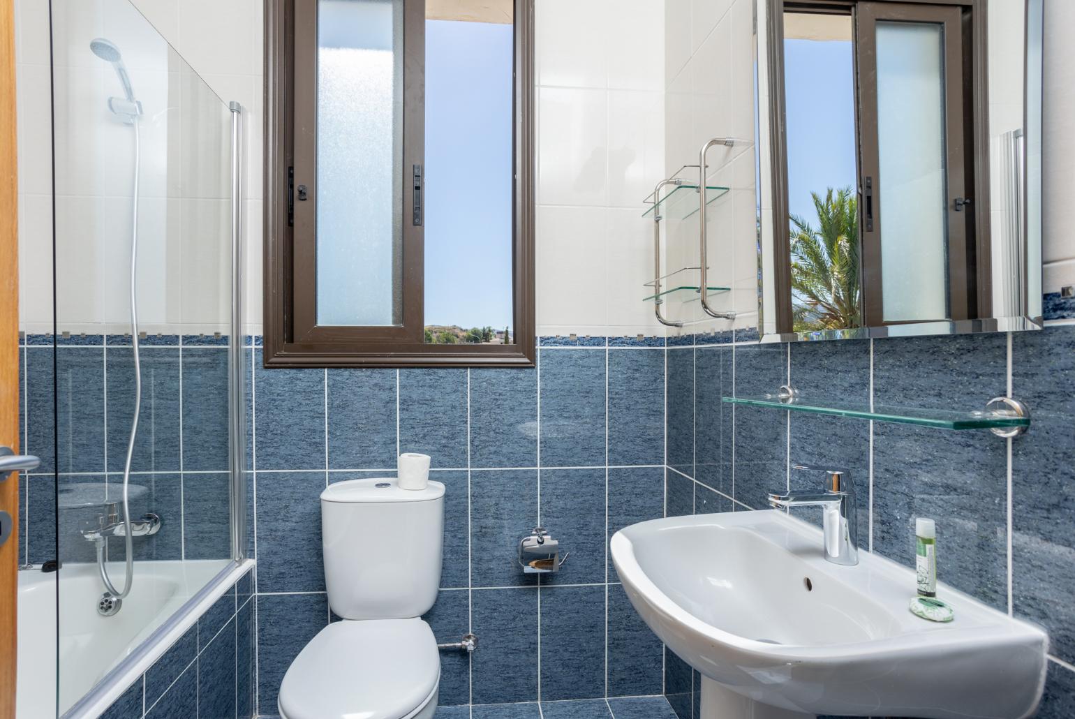 Family bathroom with bath and shower