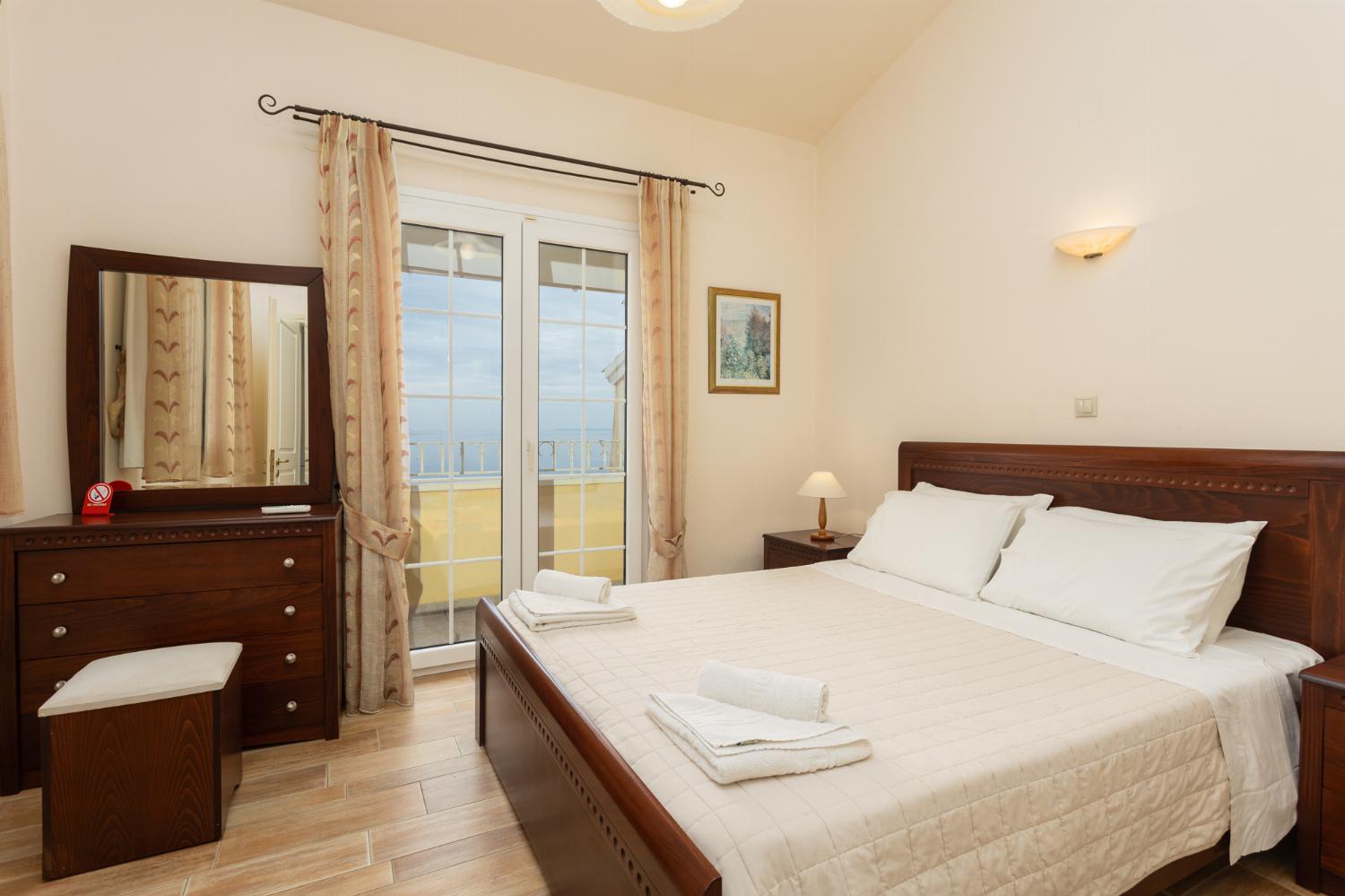Double bedroom on second floor with A/C, sea views, and balcony access