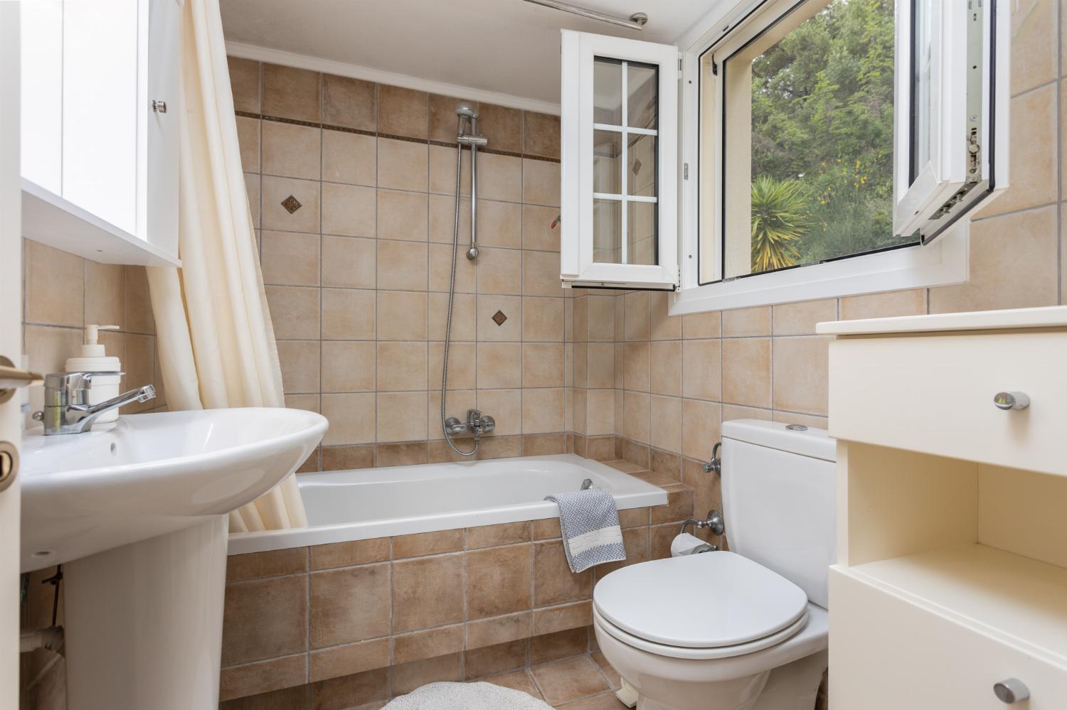 Family bathroom on second floor with bath and shower