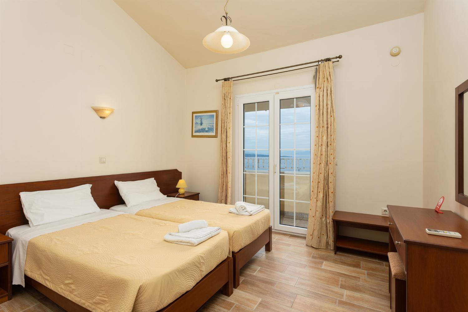 Twin bedroom on second floor with A/C, sea views, and balcony access