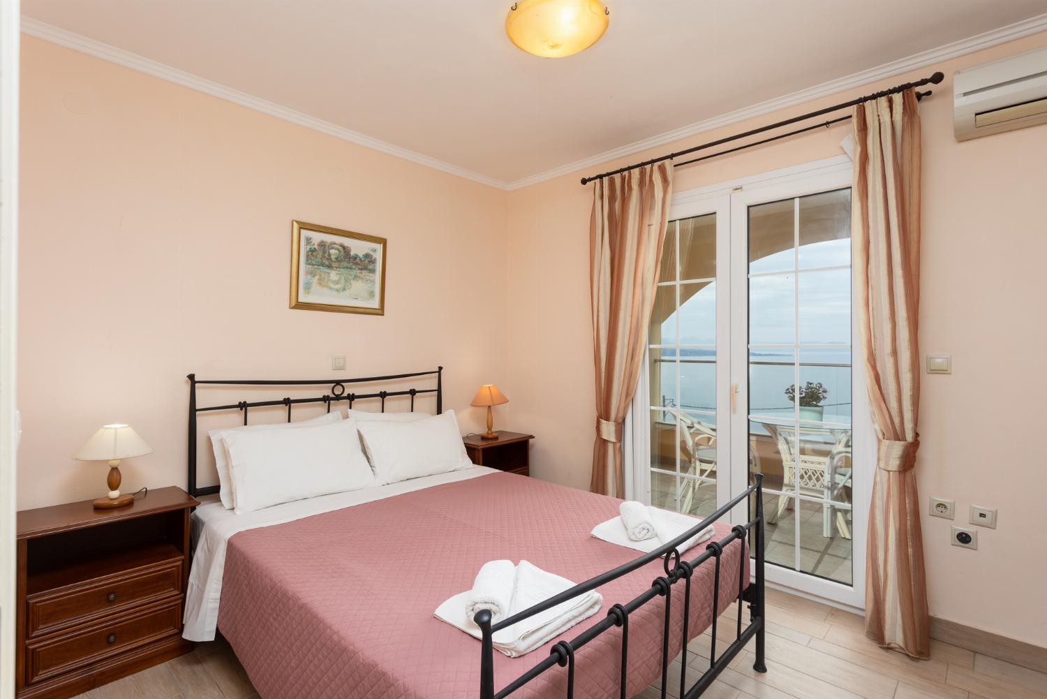 Double bedroom on ground floor with A/C, sea views, and terrace access