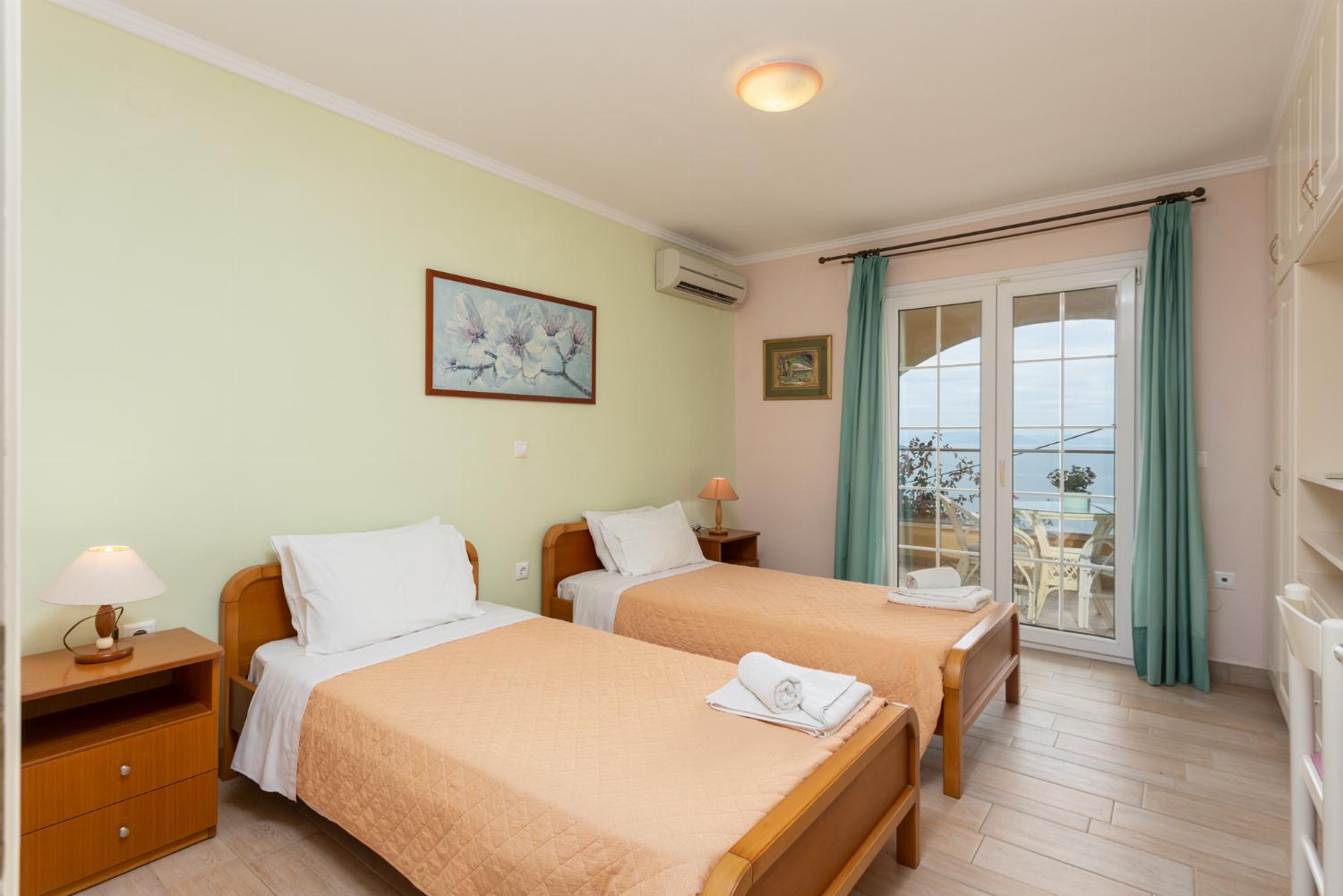 Twin bedroom on ground floor with A/C, sea views, and terrace access