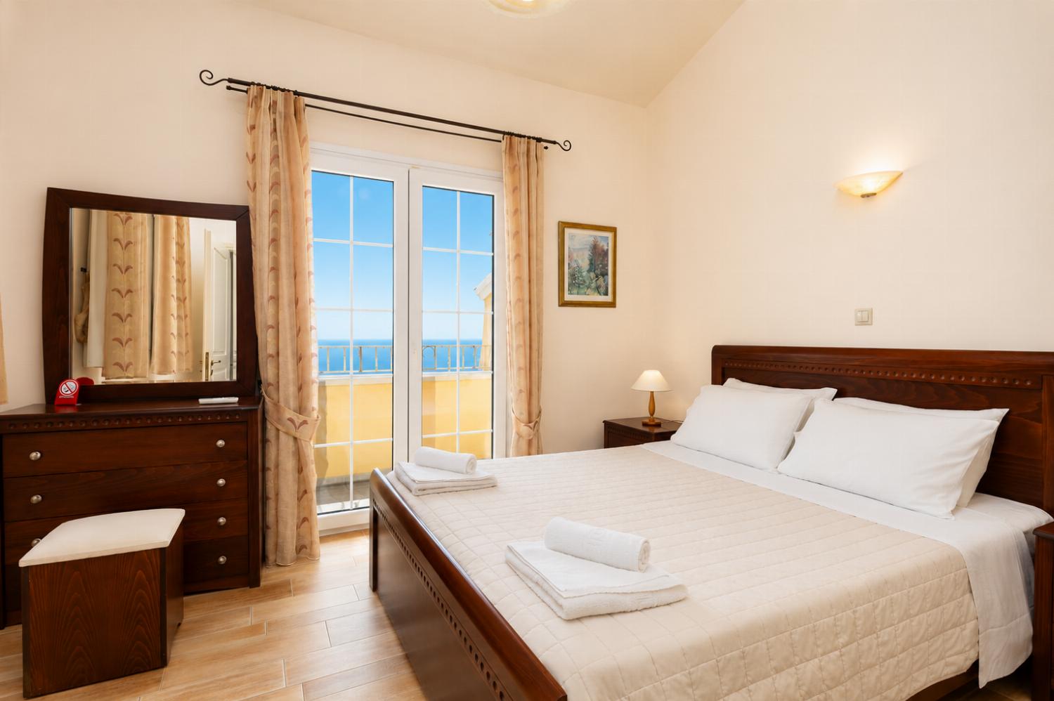 Double bedroom on second floor with A/C, sea views, and balcony access