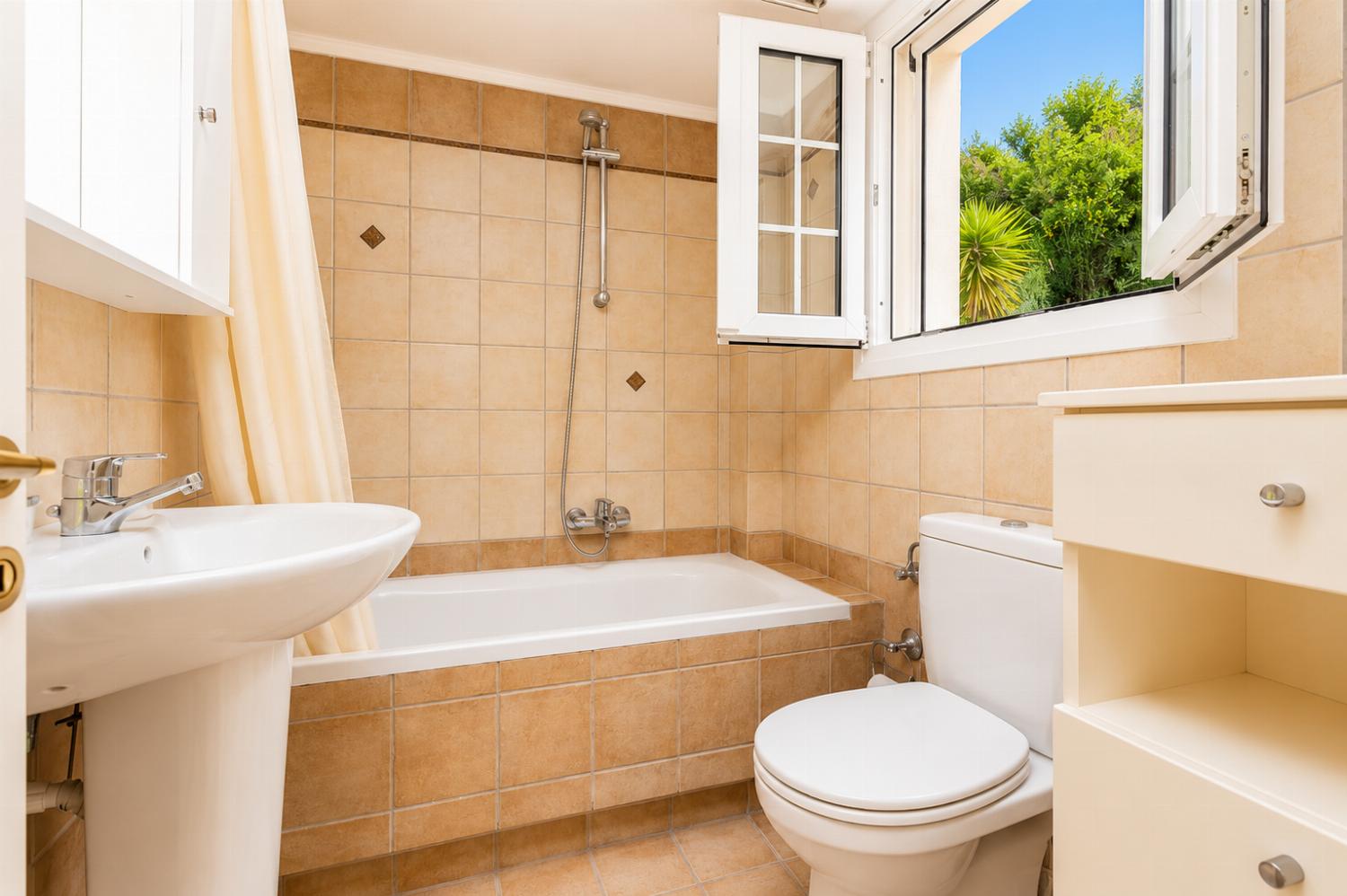 Family bathroom on second floor with bath and shower
