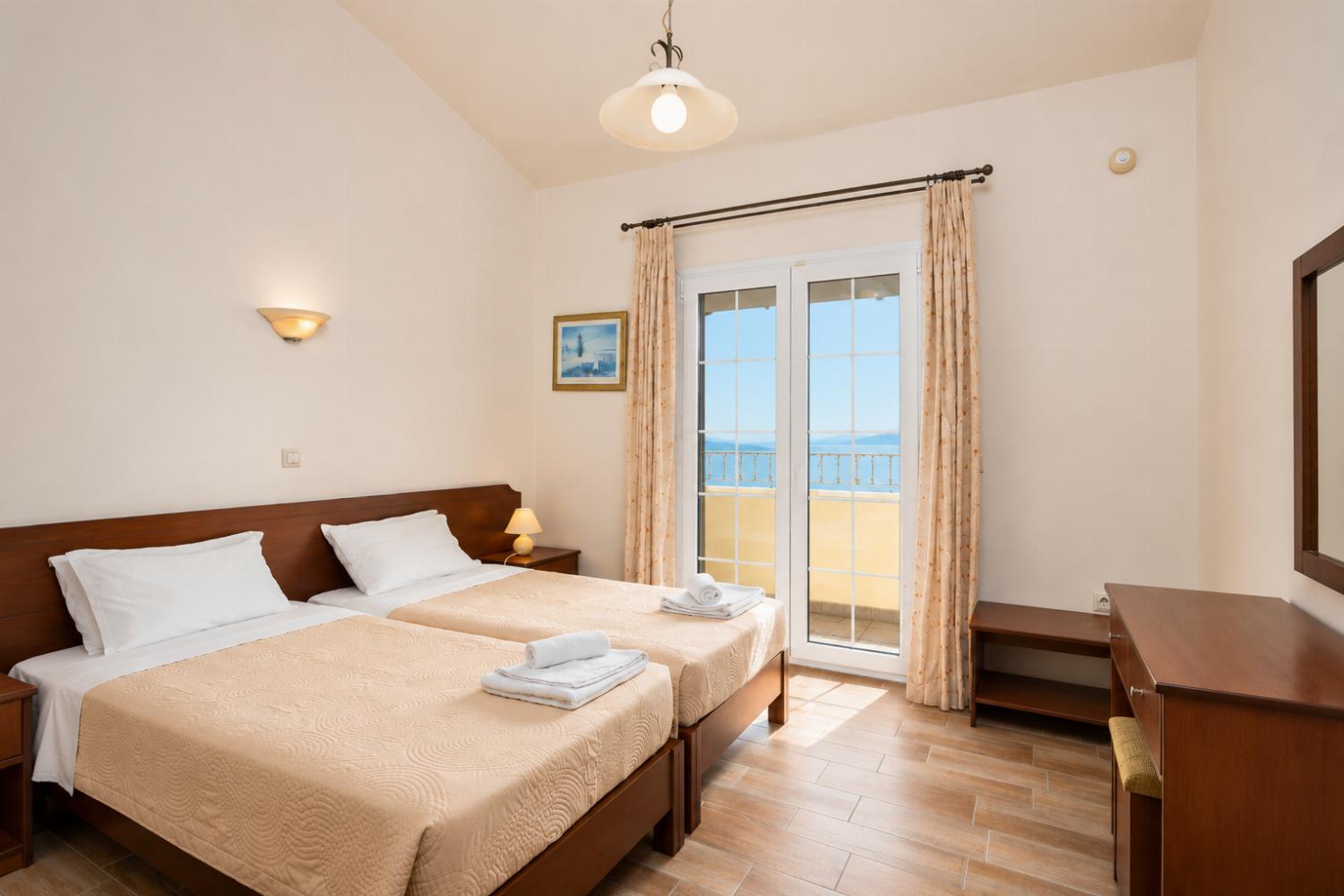 Twin bedroom on second floor with A/C, sea views, and balcony access