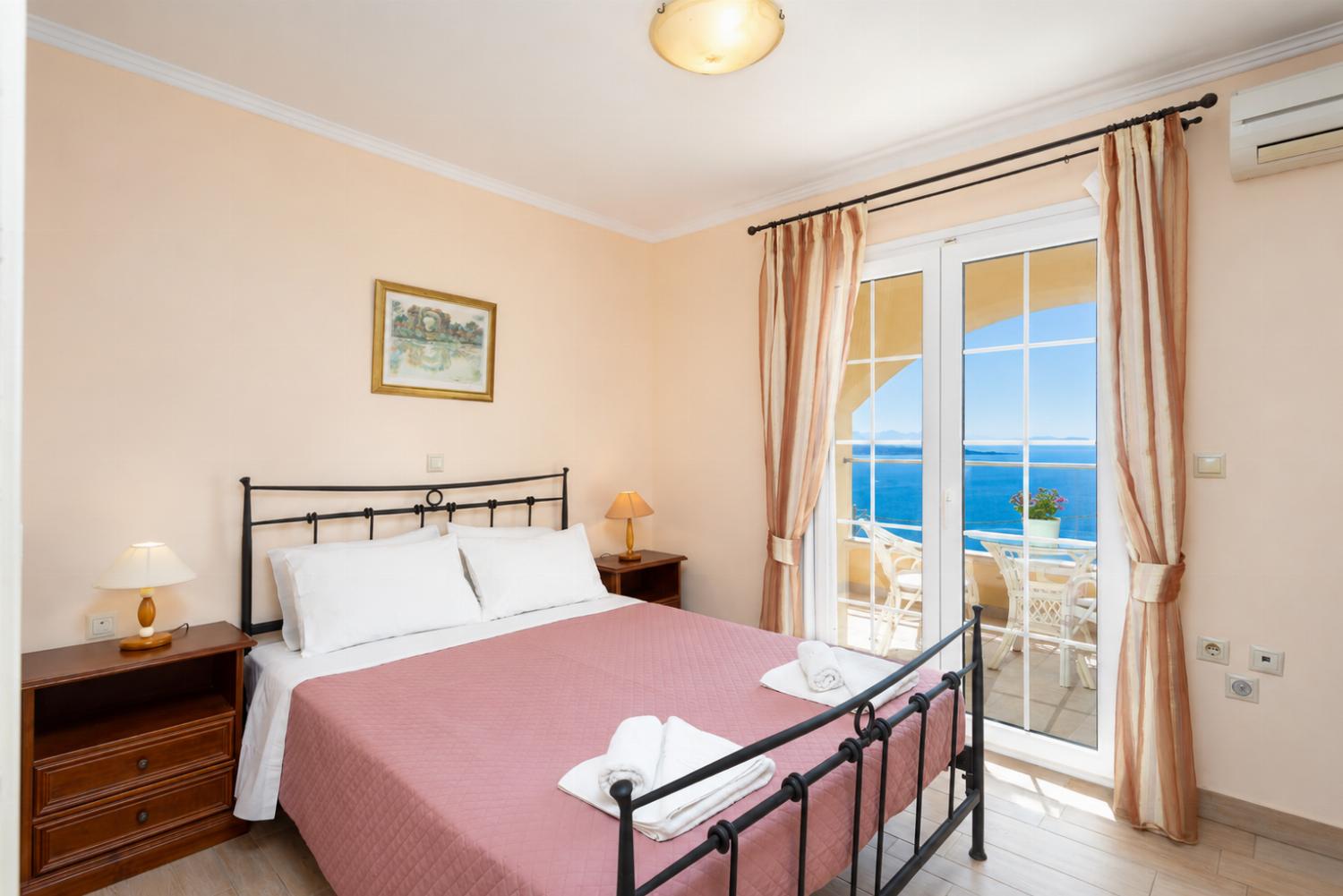 Double bedroom on ground floor with A/C, sea views, and terrace access