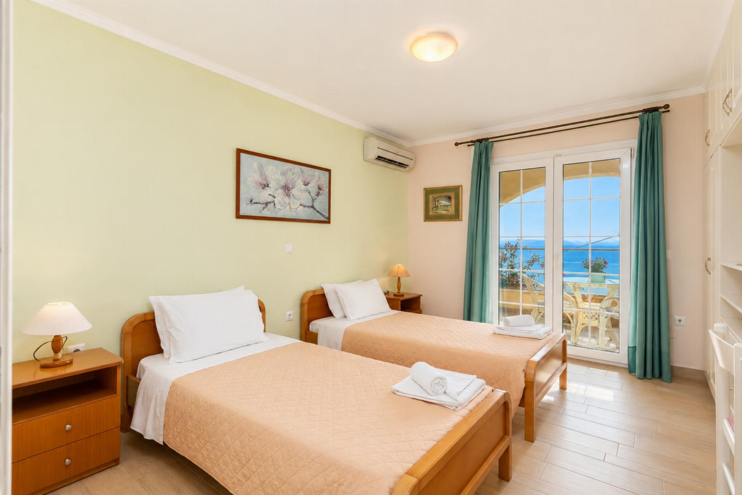 Twin bedroom on ground floor with A/C, sea views, and terrace access