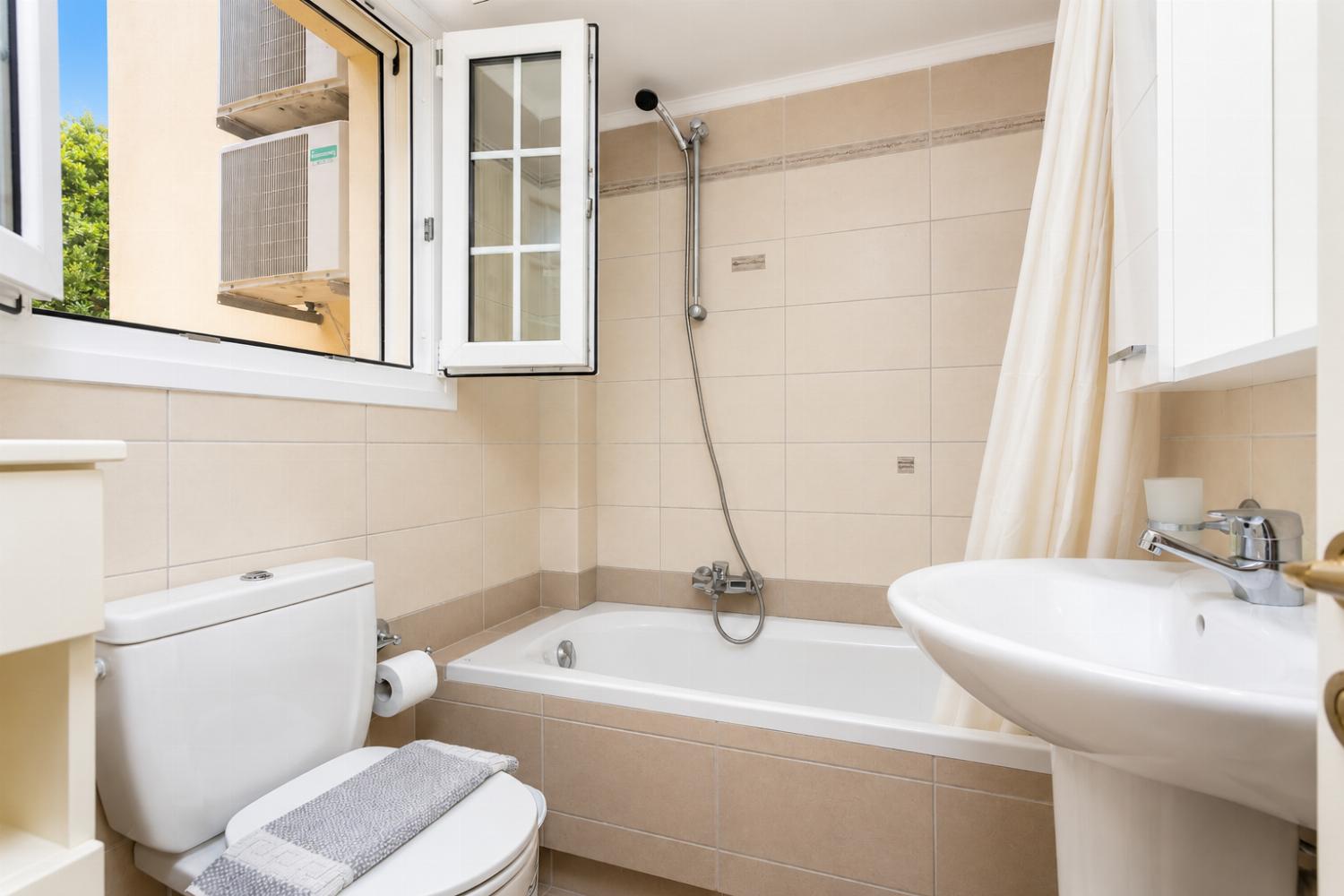Family bathroom with bath and shower