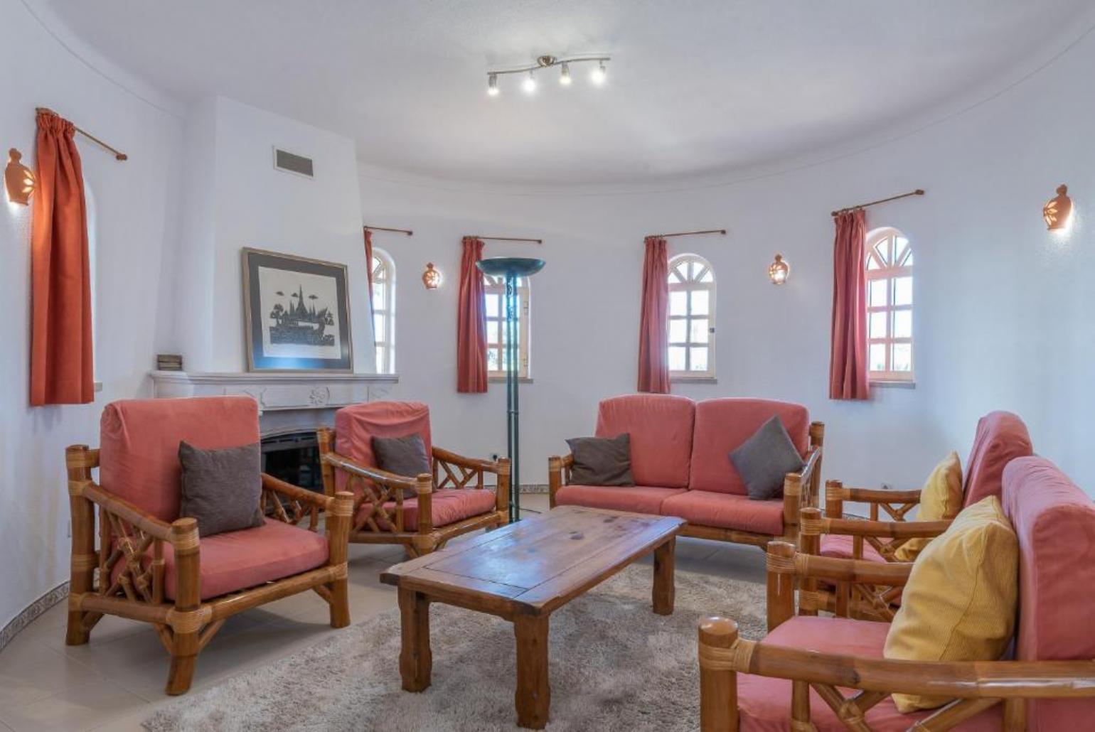 Living room with ornamented fireplace and wi-fi