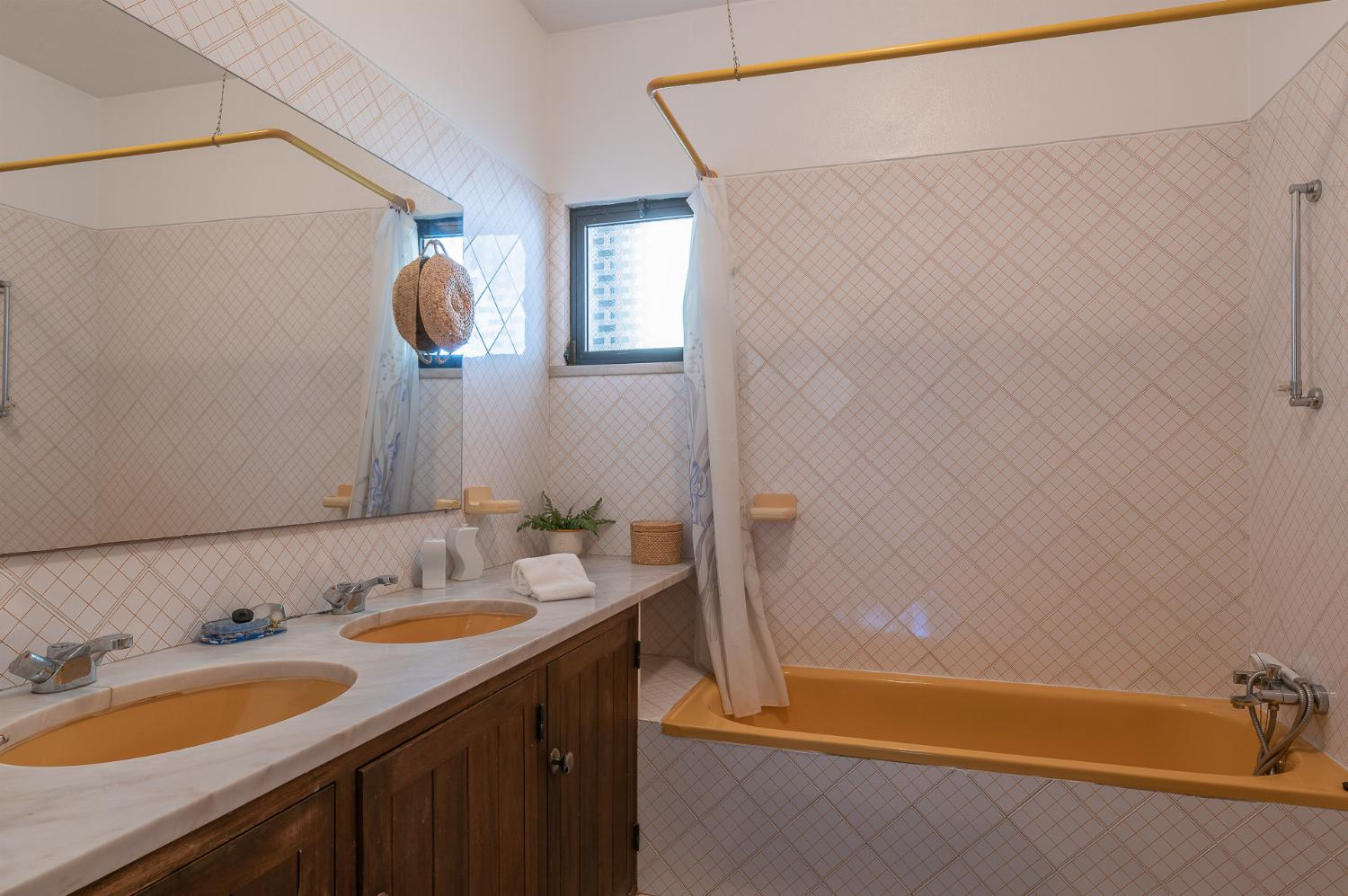 Ensuite bathroom with bath and WC